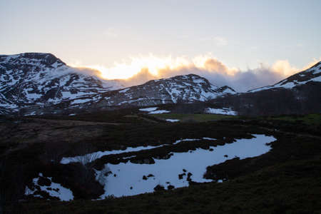 In the province of Burgos, in Espinosa de los Monteros, there are bathing areas where you can go swimming if you dare with the cold water of a mountain river. At sunset the colors are more beautiful. Girls walking along nature trails.の写真素材