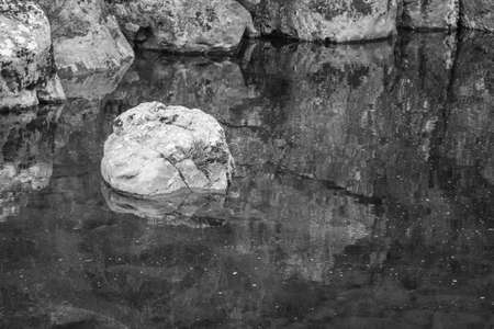 In the province of Burgos, in Espinosa de los Monteros, there are bathing areas where you can go swimming if you dare with the cold water of a mountain river. At sunset the colors are more beautiful. Girls walking along nature trails.の写真素材