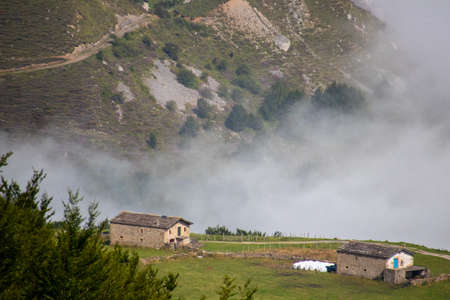 In the Espinosa de los Monteros Mountains, in the Cantabrian Mountains, you can see natural spectacles such as this one, where a sea of clouds crashes against the steep mountain slopes.の写真素材