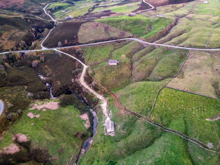 The Pasiego people live in the municipality of Espinosa de los Monteros, Spain. Its origins go back to the history of Espinosa. Aerial view from a drone of the mountain landscape in autumn.の写真素材