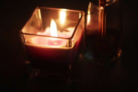 Romantic theme: fire of candle and aroma sticks