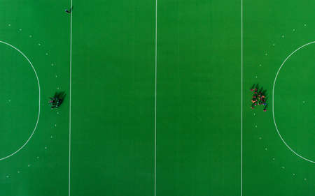 Aerial view of hockey on the grass. Top view. Pattern green fieldの写真素材