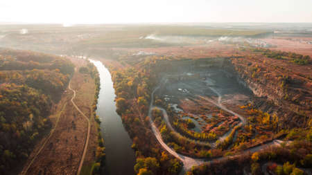 drone with a camera, beautiful river through career and forest. Cの写真素材