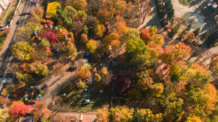 Autumn aerial photo of Ferris wheel landscape. Park and yellow trees. Romantic and comfort atmosphereの写真素材