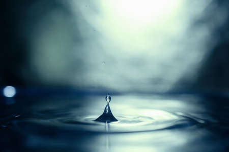 drops of pure water on blue backgroundの写真素材