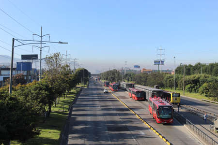 A Wiew of Pollution cloud in blue sky with Transmilenio Station in bogota's first No Car Day of the...
