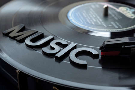 close up to a music lettering word over turntable with red needle and LP vinyl disc. Music loversの写真素材