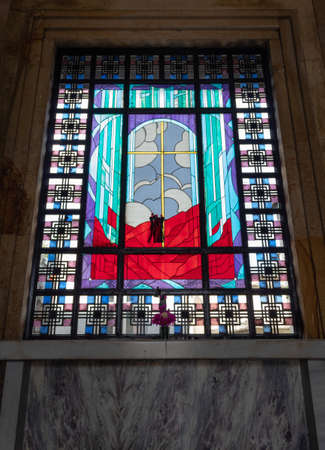 Colorful stained glass window in altar into military mausoleum in Central Cemeteryのeditorial素材