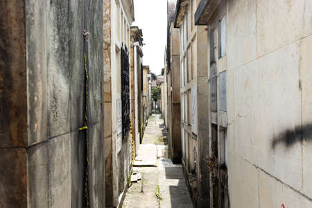 Old Crypts and mausoleums paths in sunny day at Cemetery located in downtown cityのeditorial素材