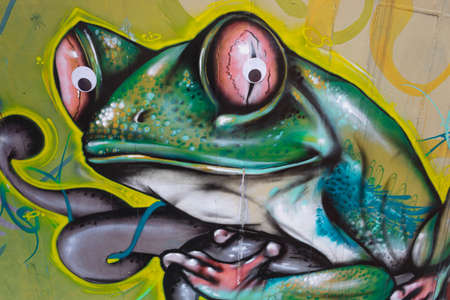 BOGOTA, COLOMBIA - AUGUST 08 OF 2020 A green frog with funny eyes graffiti in a north city wallのeditorial素材