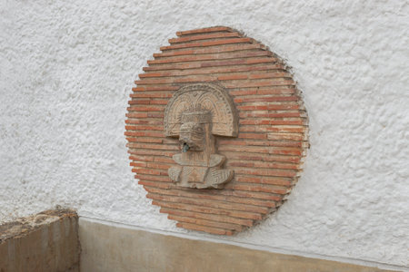 GUATAVITA, COLOMBIA - Closeup to a brick dry water fountain with a pre columbus muisca cultre figure in middle of town.のeditorial素材