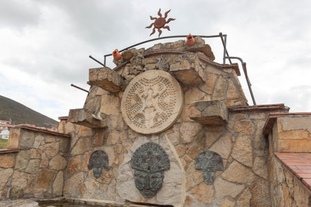 GUATAVITA, COLOMBIA - Sun atrium with muisca pre columbus culture animals and people figures with ceramic pots and white skies at backgroundのeditorial素材