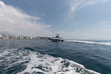 Tourist boat offshore going to Rodadero beach at backgroundのeditorial素材