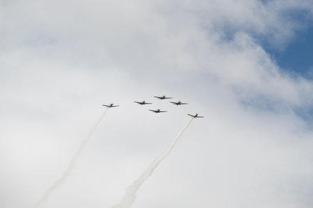 Super Tucano airplanes float flying over crowd during independence dayのeditorial素材