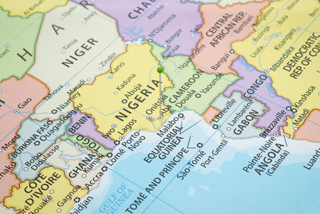 Close up to a Aba city with a green pin needle into Nigeria country political mapの写真素材