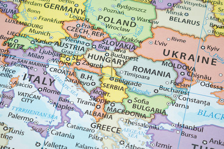 Close up to a Belgrade city with a white pin needle into Serbia country political mapの写真素材