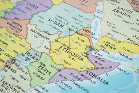 Close up to an Addis Ababa city with a green pin needle into Ethiopia country political mapの写真素材