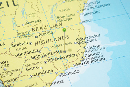 Close up to a Belo Horizonte city with a green pin needle into Brazil country political mapの写真素材