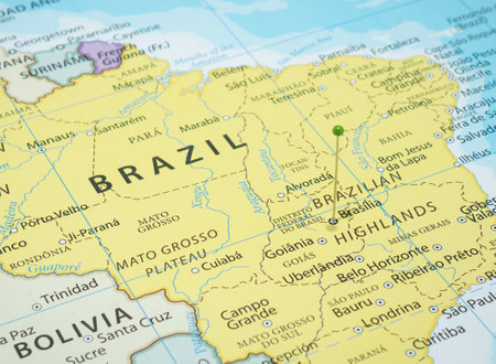 Close up to a Brasilia city with a green pin needle into Brazil country political mapの写真素材