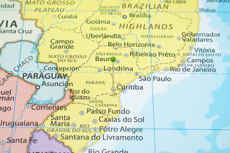 Close up to a Curitiba city with a green pin needle into Brazil country political mapの写真素材