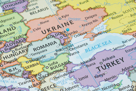 Close up to a Constanta city with a light blue pin needle into Romania country political mapの写真素材