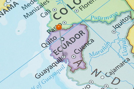 Close up to a Guayaquil city with an orange pin needle into Ecuador country political mapの写真素材