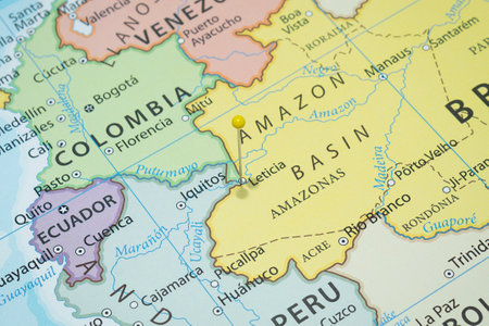 Close up to a Leticia city with a yellow pin needle into Colombia country political mapの写真素材