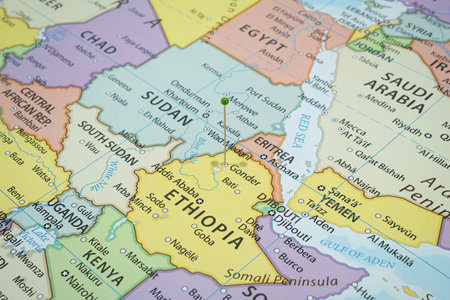 Close up to a Gonder city with a green pin needle into Ethiopia country political mapの写真素材