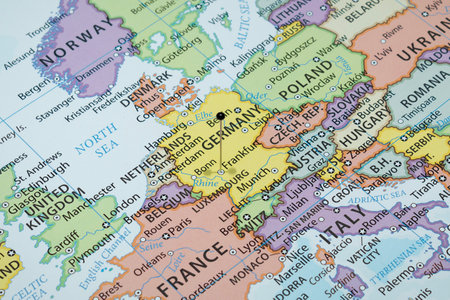Close up to a Frankfurt city with a black pin needle into Germany country political mapの写真素材