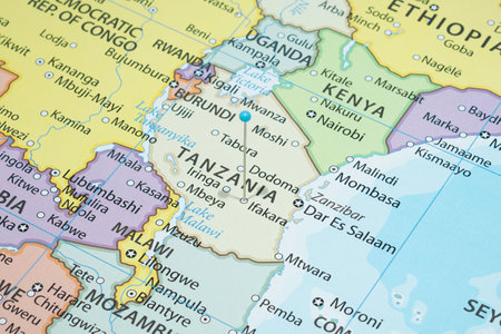 Close up to a Ifakara city with a light Blue pin needle into Tanzania country political mapの写真素材