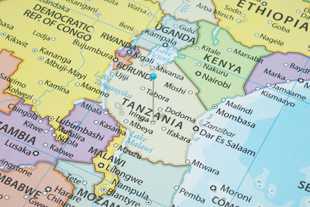 Close up to a Iringa city with a Light Blue pin needle into Tanzania country political mapの写真素材