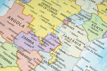 Close up to a Kasama with a yellow pin needle into Zambia country political mapの写真素材