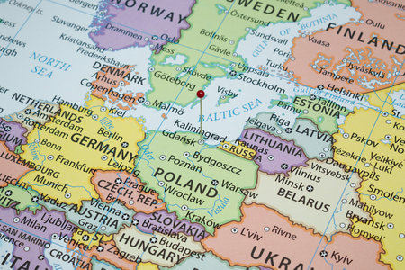 Close up to a Gdansk city with a red pin needle into Poland country political mapの写真素材