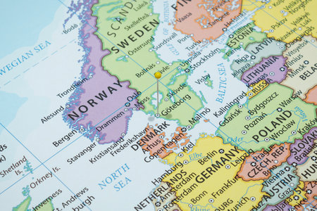 Close up to a Gothenburg city with a yellow pin needle into Sweden country political mapの写真素材