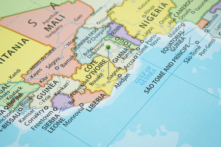 Close up to a Gagnoa city with a green pin needle into Ivory Coast country political mapの写真素材