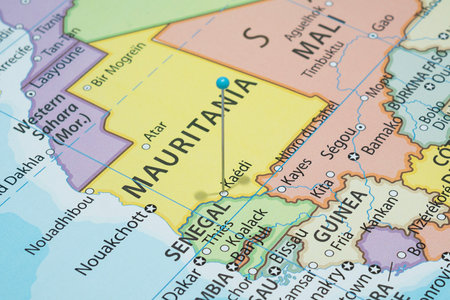 Close up to a Kaedi city with a light blue pin needle into Mauritania country political mapの写真素材