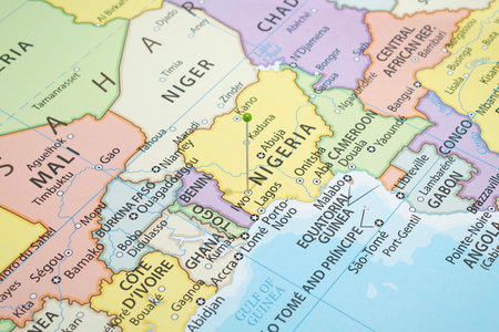 Close up to a Iwo city with a green pin needle into Nigeria country political mapの写真素材