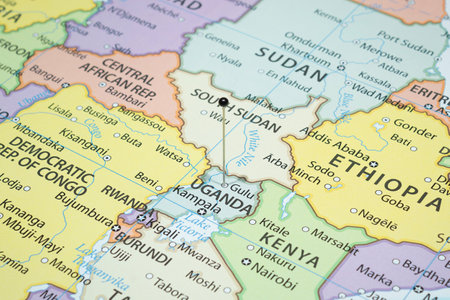 Close up to a Gulu city with a black pin needle into Uganda country political mapの写真素材