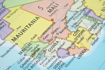 Close up to a Kita city with an orange pin needle into Mali country political mapの写真素材