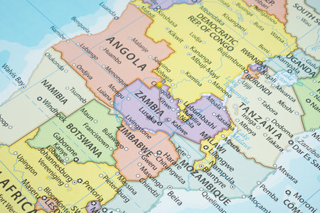 Close up to a Lusaka with a yellow pin needle into Zambia country political mapの写真素材