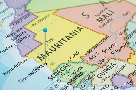 Close up to a Nouakchott with a light blue pin needle into Mauritania country political mapの写真素材
