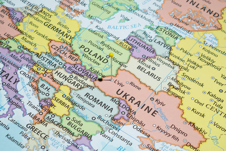 Close up to a Lviv city with a Yellow pin needle into Ukraine country political mapの写真素材
