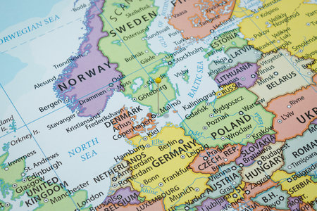 Close up to a Malmo city with a yellow pin needle into a political mapの写真素材