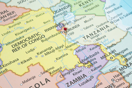 Close up to a Manono city with a red pin needle into Democratic Republic of the Congo country political mapの写真素材
