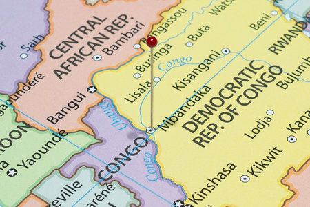 Close up to a Mbandaka city with a red pin needle into Democratic Republic of the Congo country political mapの写真素材
