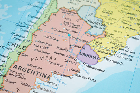 Close up to a Rosario city with a light blue pin needle into Argentina country political mapの写真素材