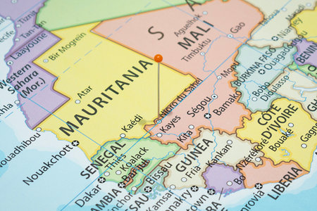 Close up to a Nioro Du Sahel city with an orange pin needle into Mali country political mapの写真素材