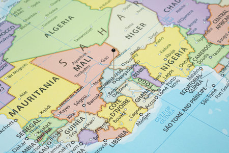 Close up to a Ouagadougou city with a black pin needle into Burkina Faso country political map