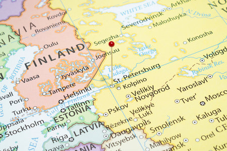 Close up to a Saint Petersburg city with a red pin needle into Russia country political map