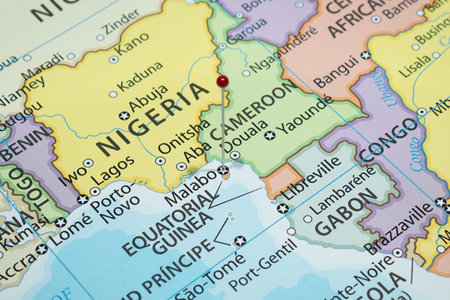 Close up to a Malabo city with a red pin needle into Equatorial Guinea country political map